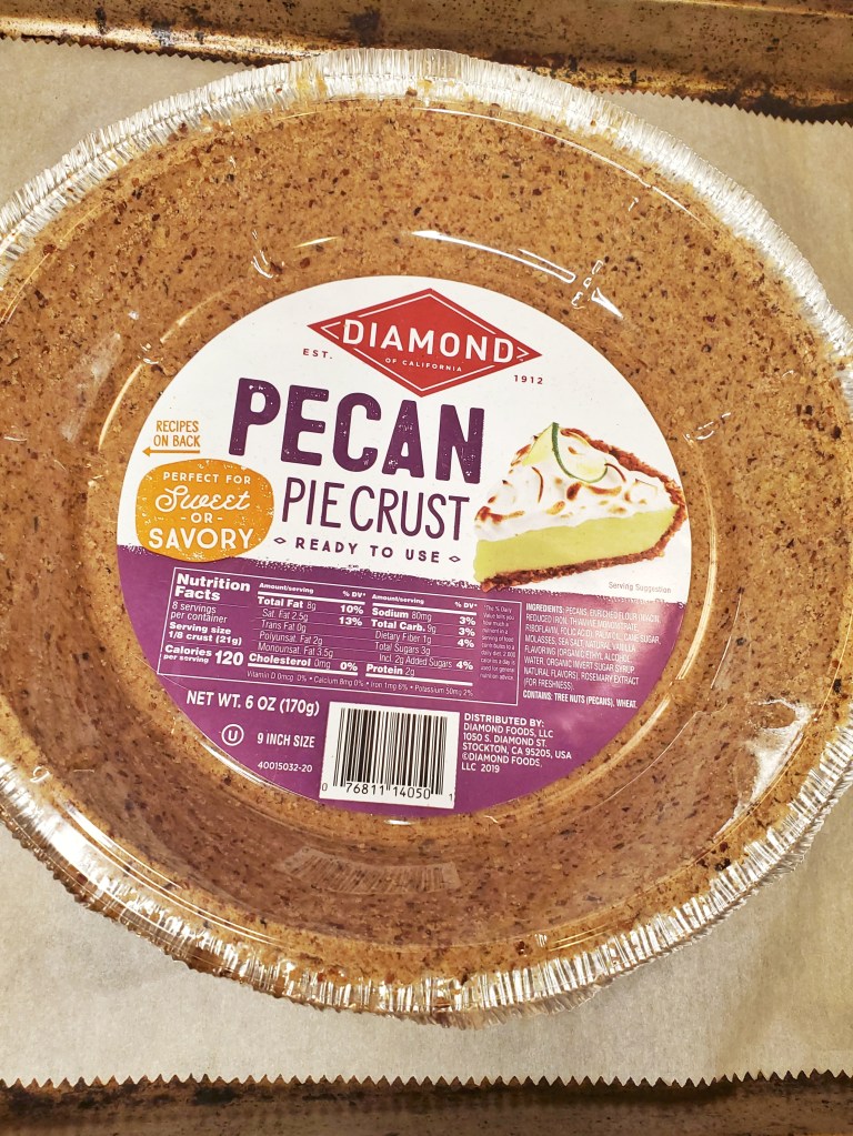 picture of a commercially made pie crust by Diamond brand, specifically a pecan pie crust, ready to use, with nutritional information on the label.